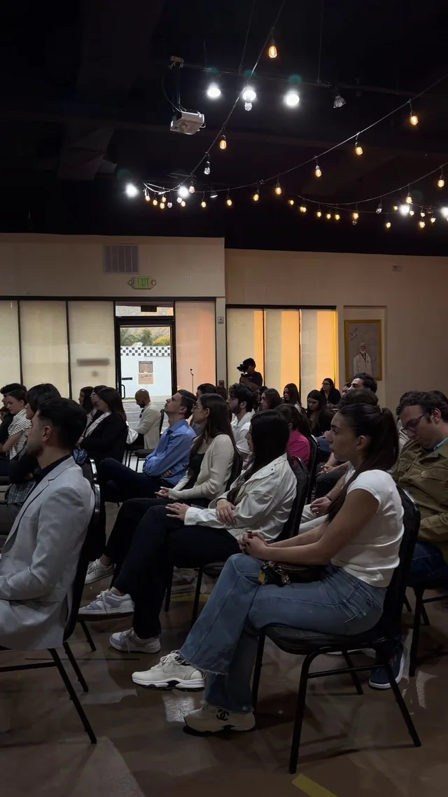 Rows of attendees listening during the KaraContent presentation.