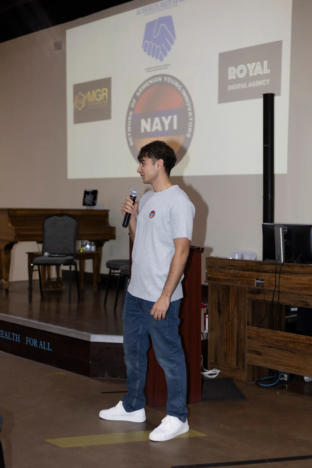 A young speaker addressing the room at NAYI × KaraContent.