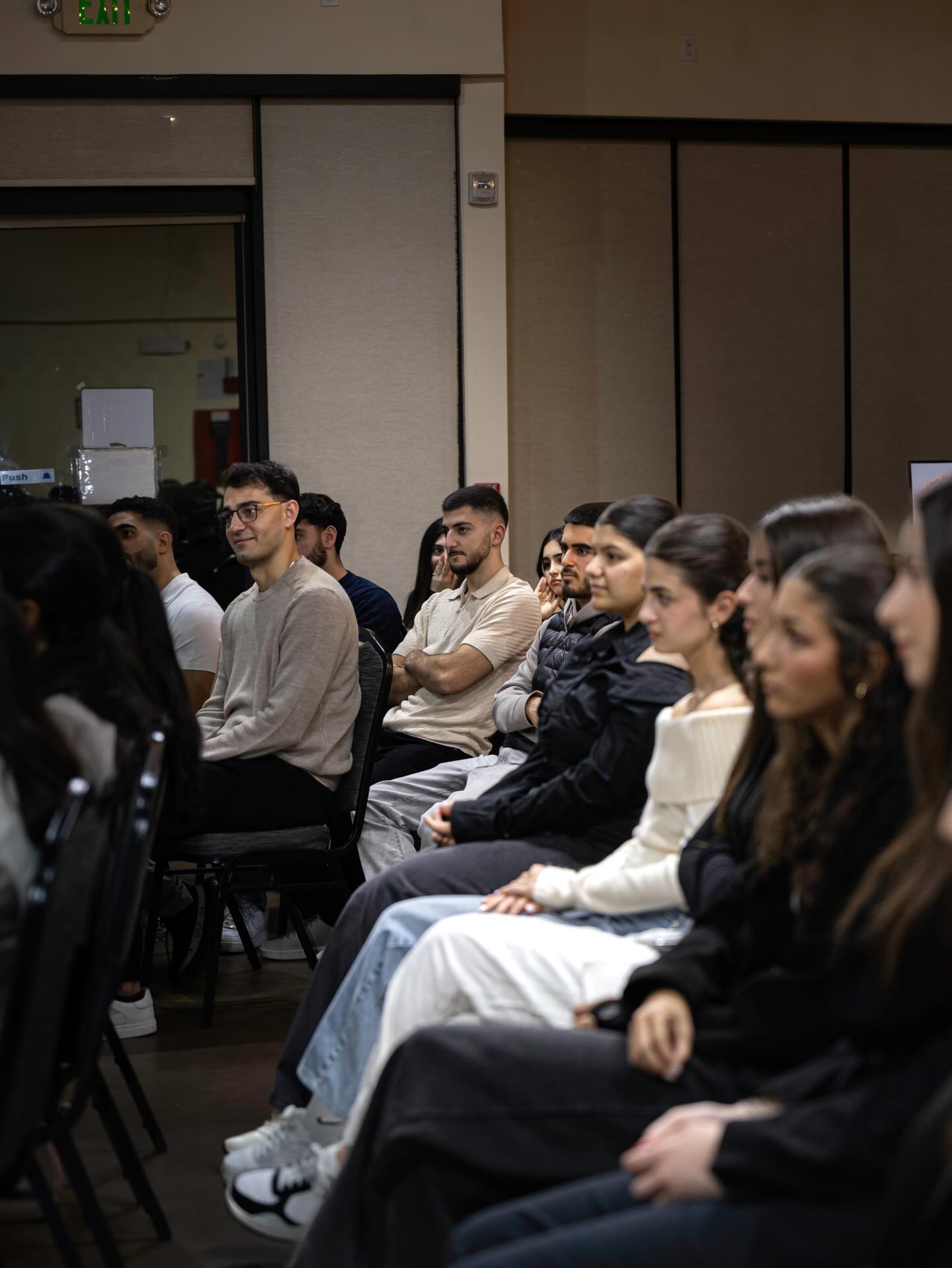 Young Armenians listening during a NAYI event.