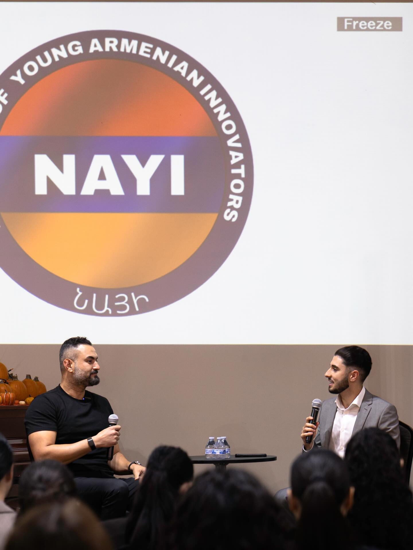 A NAYI speaker addressing a room of young people.